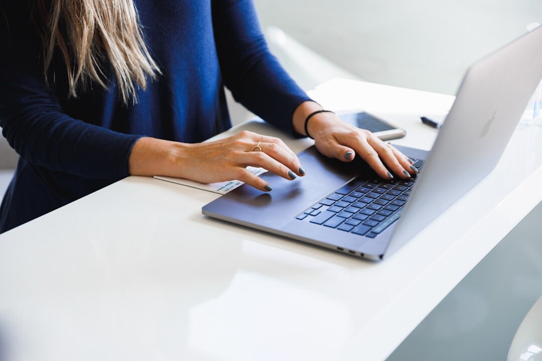 Person working with media and digital technology on laptop