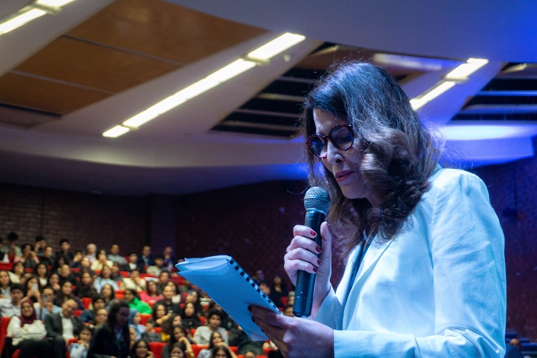 Speaker presenting to an audience at a conference